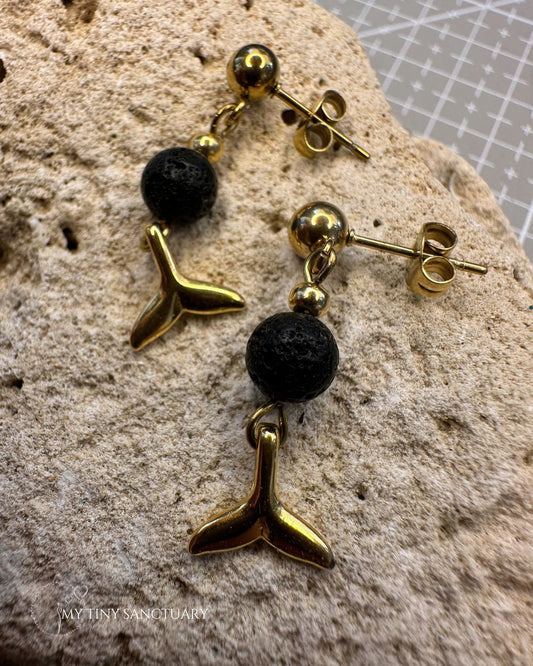 Dolphin Gold Tale with Black Lava Stone •