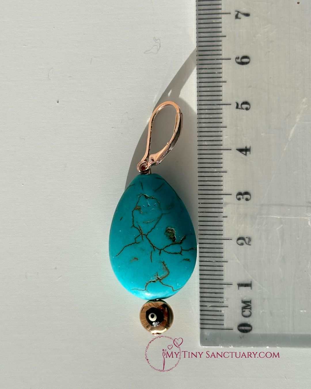 Les Boucles d'Oreilles en Howlite Turquoise et Œil de Mati en Or Rose