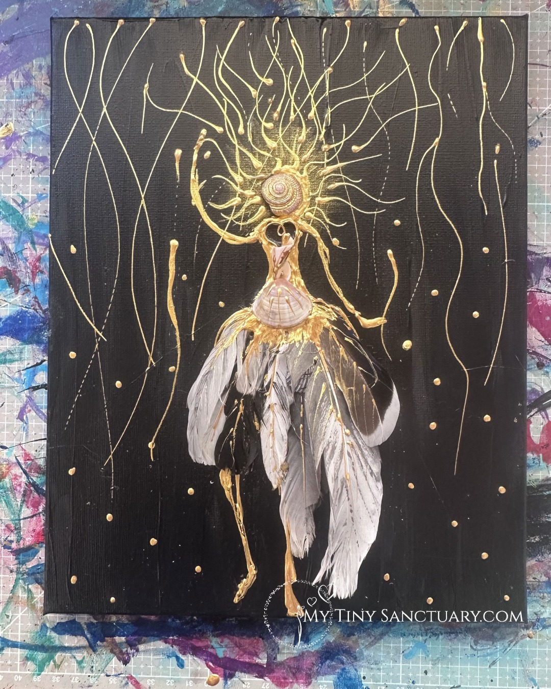 The Raw Women, a 30x24cm mixed media artwork by Christel Mesey. Combines acrylic paint with natural seashells and feathers collected from Greek and UK shores. Depicts an untamed female figure representing freedom, boundary-setting, and raw feminine energy.